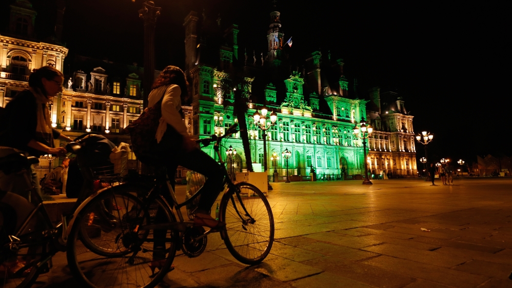 Paris city hall was lit green after Trump withdrew from the Paris agreement [Philippe Wojazer/Reuters]