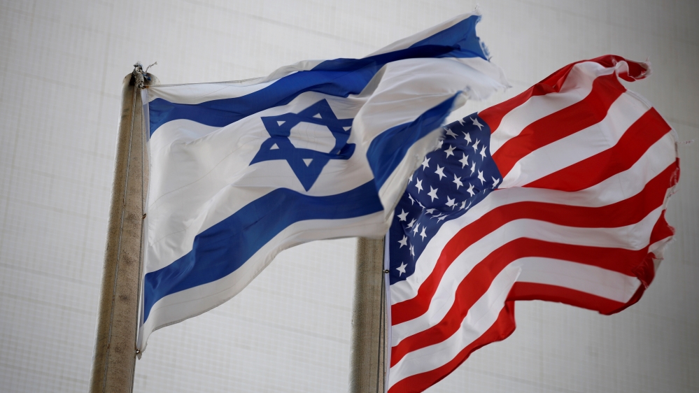 The American and the Israeli national flags can be seen outside the U.S Embassy in Tel Aviv