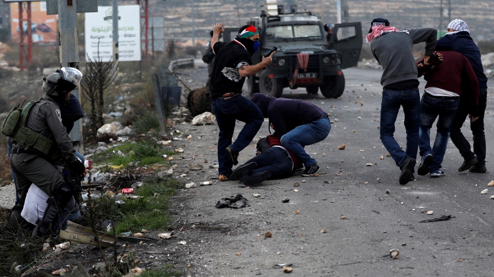 The Palestinian Red Crescent has provided medical assistance to more than 1,933 people in the Palestinian territories since Trump's announcement [Mohamad Torokman/Reuters]