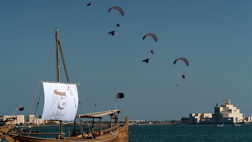 The Qatari capital was decked out with flags and images of Emir Sheikh Tamim bin Hamad Al Thani as part of the National Day celebrations [Sorin Furcoi/Al Jazeera] 