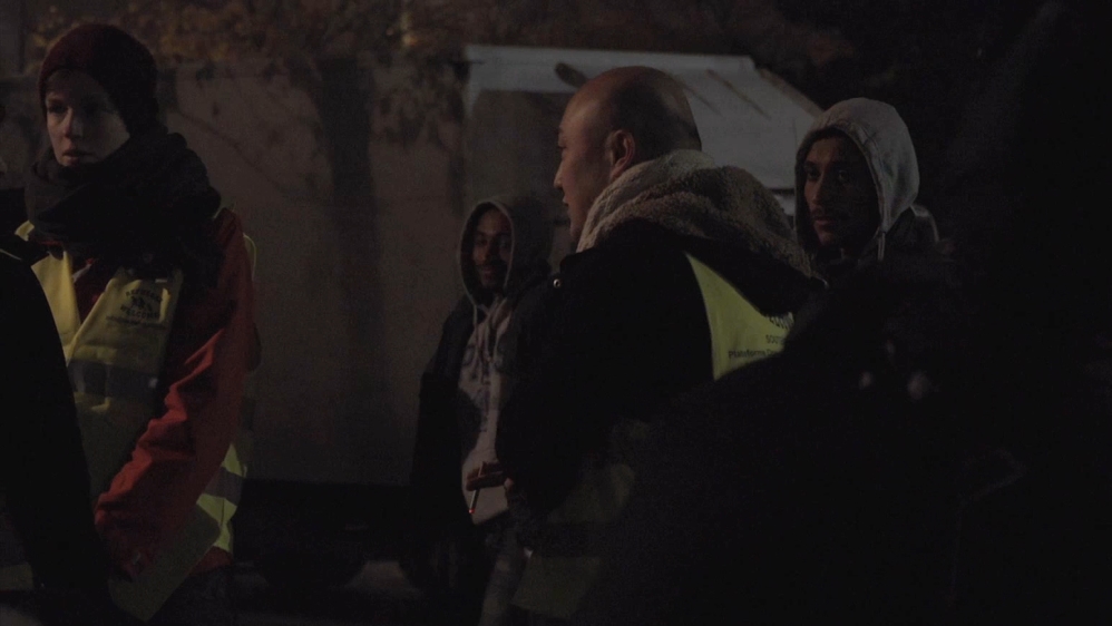 Volunteers try to find a safe place to sleep for undocumented men, women and children each night in a park in Brussels, Belgium. [Al Jazeera]