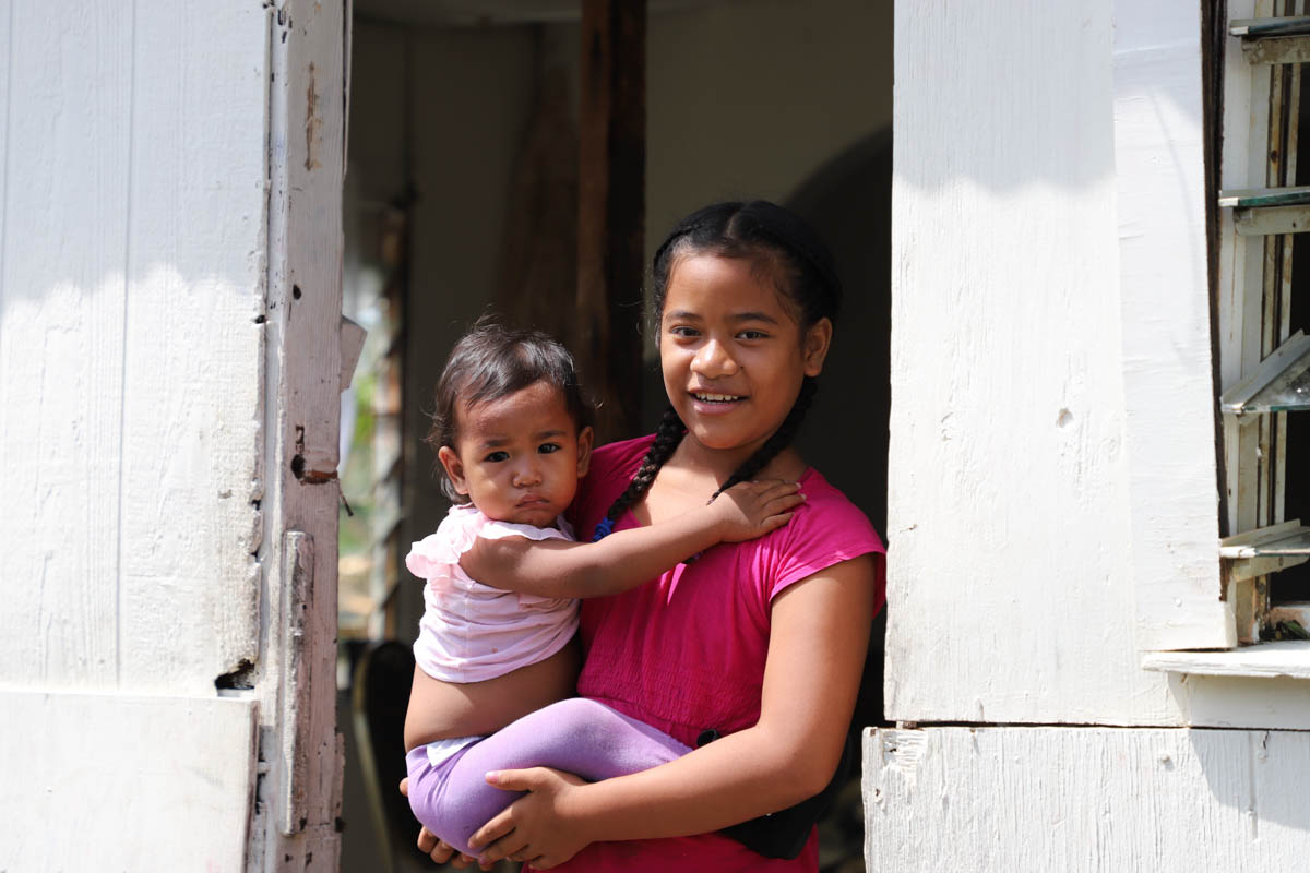 These siblings lost the side of their house to Tropical Cyclone Gita. The family received tarps and a shelter kit from Red Cross volunteers to assist with their immediate needs.