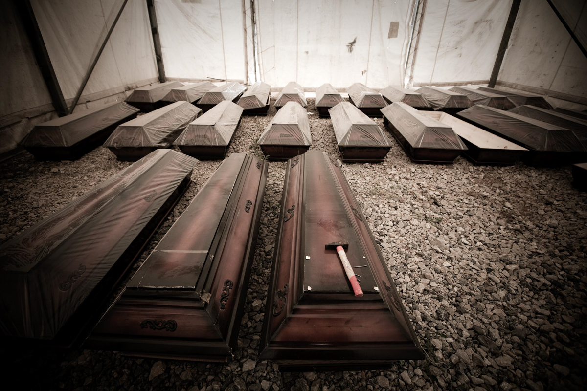 Outside Pristina hosptial, the UN has set up a tent where the bodies are put back in coffins and then delivered to families.