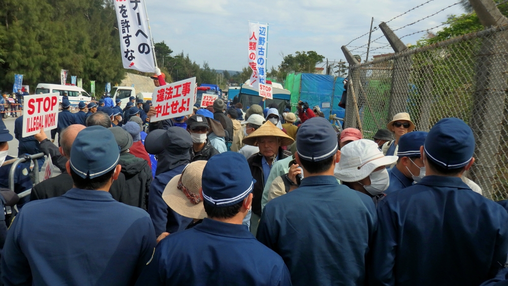 Okinawans stage anti-base demonstrations in front of Camp Schwab in Henoko in February 2018 [Lisa Torio/Al Jazeera] 