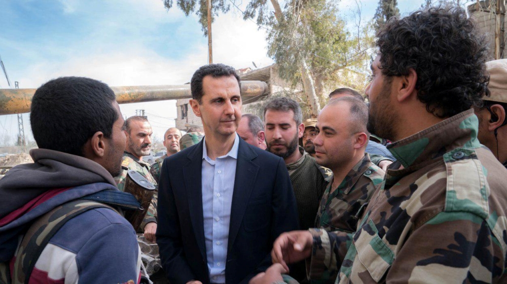 Syrian President Bashar al-Assad meets with Syrian army soldiers in eastern Ghouta