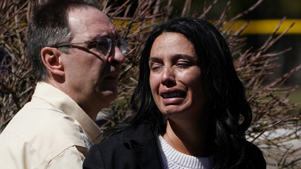 A woman reacts after a van hit dozens of people in Toronto, Ontario on Monday [Carlo Allegri/Reuters]