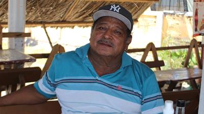 Jose Cruz Alvarenga says he is worried residents will be less inclined to spend money at his business if remittances stop [Anna-Cat Brigida/Al Jazeera]