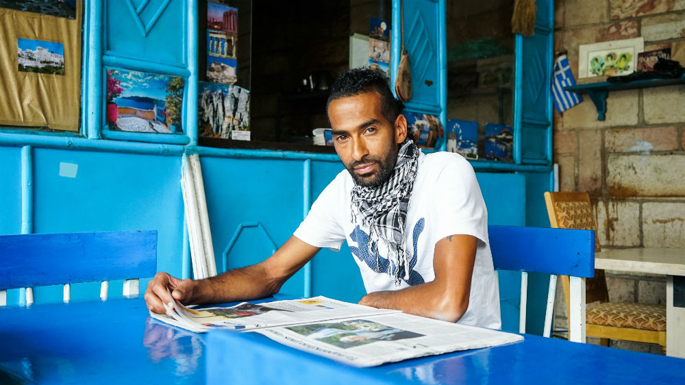 Filippos Gembiaou at the Santorini Greek Restaurant [Thomas Lewton/Al Jazeera]