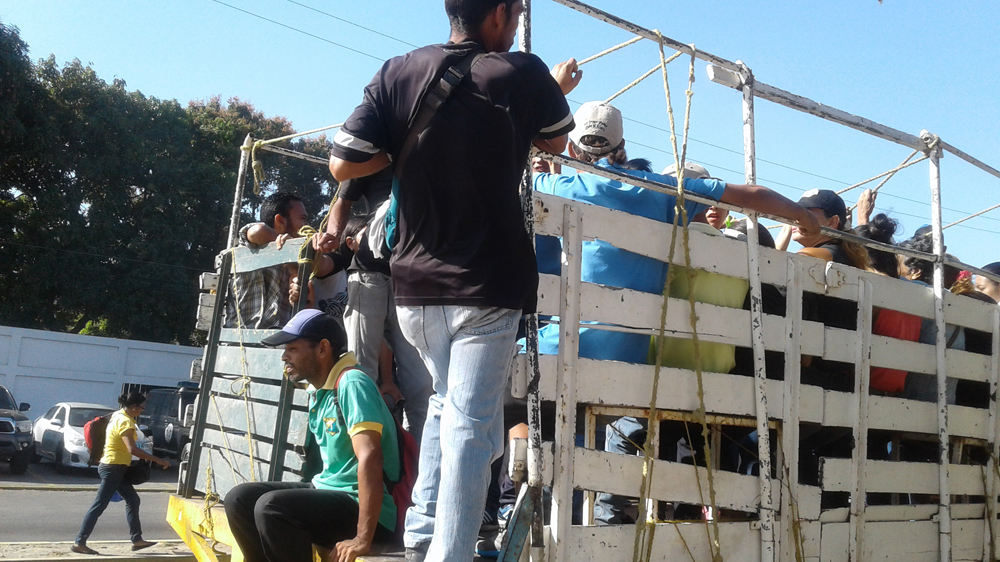 With the decline of public transport, truck drivers started trasporting passengers [Al Jazeera]