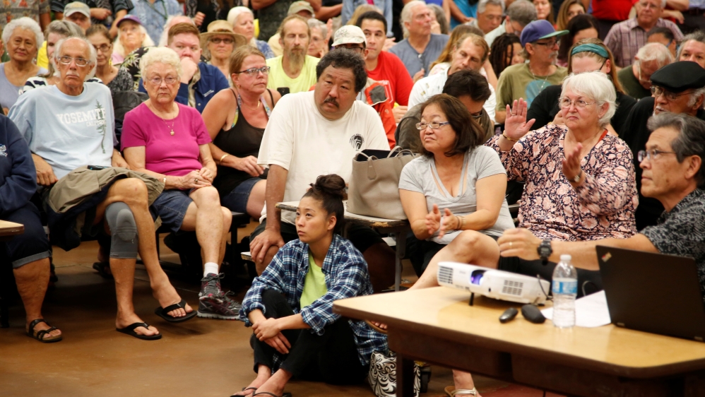 Puna district residents attend a community meeting during ongoing eruptions of the Kilauea Volcano at Pahoa High and Intermediate School [Terray Sylvester/Reuters]