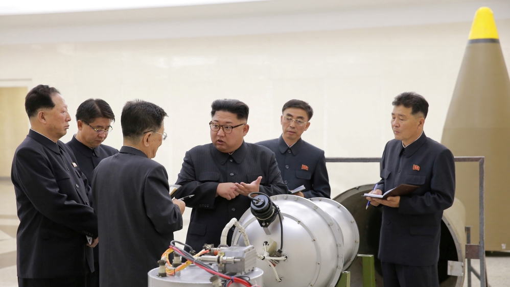 North Korean leader Kim Jong Un provides guidance with Ri Hong Sop (3rd L) and Hong Sung Mu (L) on a nuclear weapons program in this undated photo released by North Korea''s Korean Central News Agency
