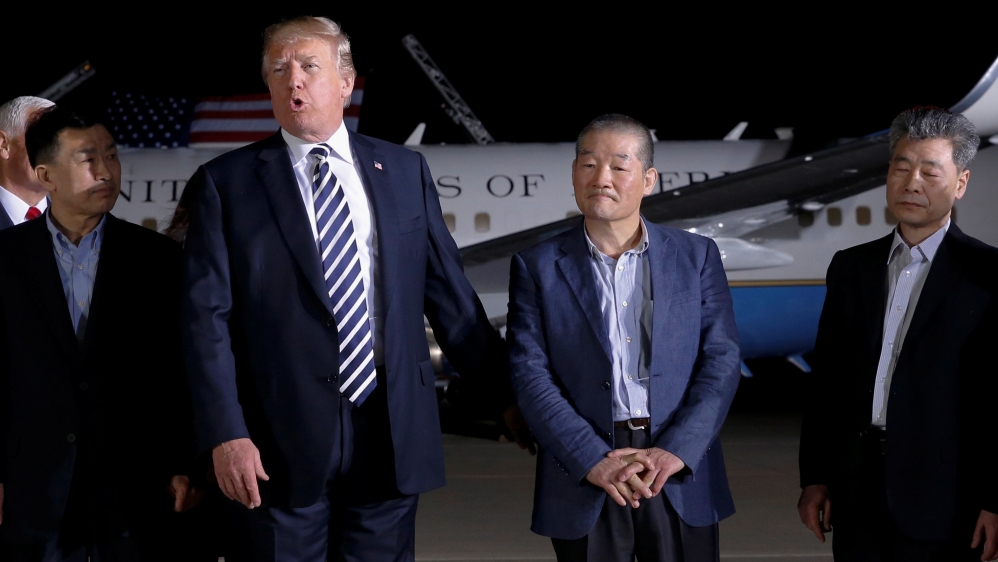 U.S.President Donald Trump speaks to the media next to the Americans released from detention in North Korea, Tony Kim, Kim Hak-song and Kim Dong-chul, upon their arrival at Joint Base Andrews