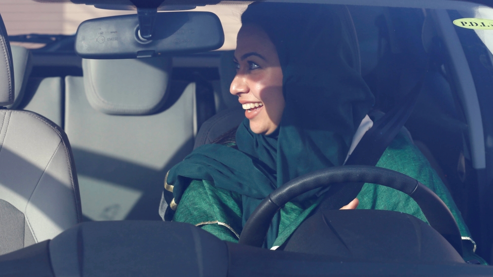 Saudi woman sits in a car during a driving training at a university in Jeddah