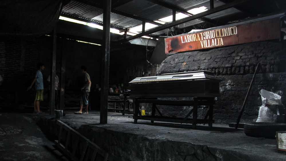 The demand for coffins has forced manufacturers to improvise their workshops   [Ali Rae/Al Jazeera]