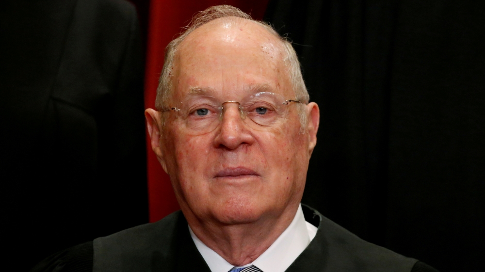 FILE: PHOTO: Justice Kennedy participates in taking a new family photo with fellow justices at the Supreme Court building in Washington