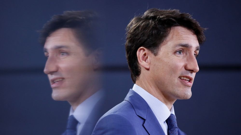 Canada''s PM Trudeau is reflected in a monitor while speaking during a news conference in Ottawa