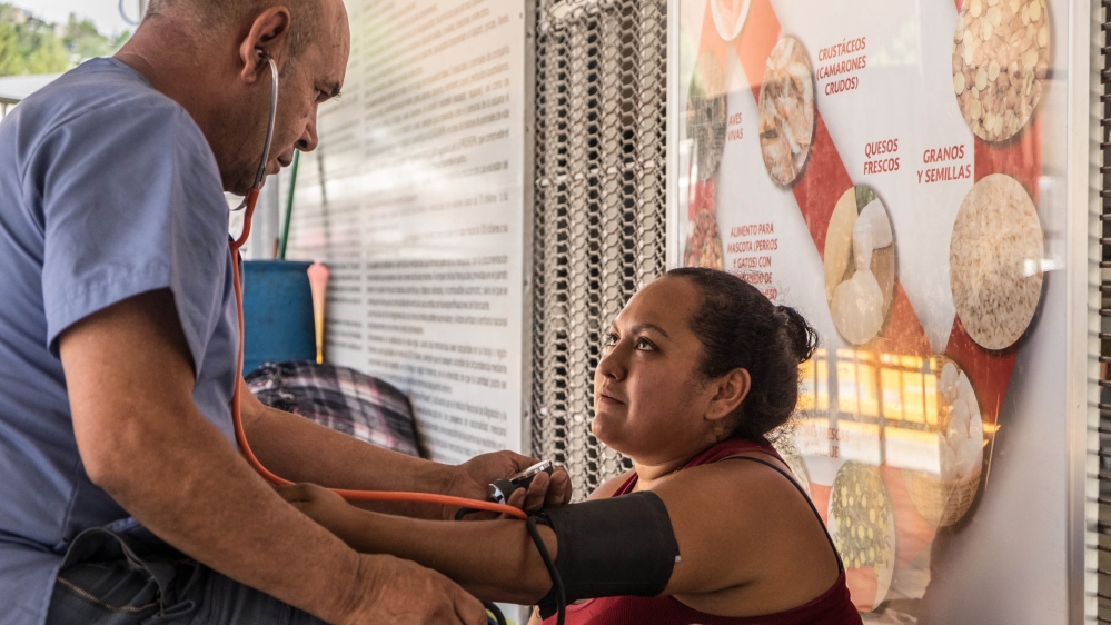 Gonzales is checked by Panchito after arriving at the port of entry in Nogales [Eline van Nes/Al Jazeera]