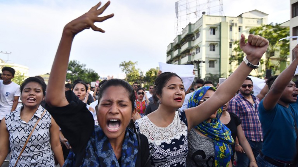 Indian students shout slogans during a protest march demanding to arrest and punish the culprits involved in the killing of two youth in Karbi Anglong district of Assam, in Guwahati on June 10, 2018.