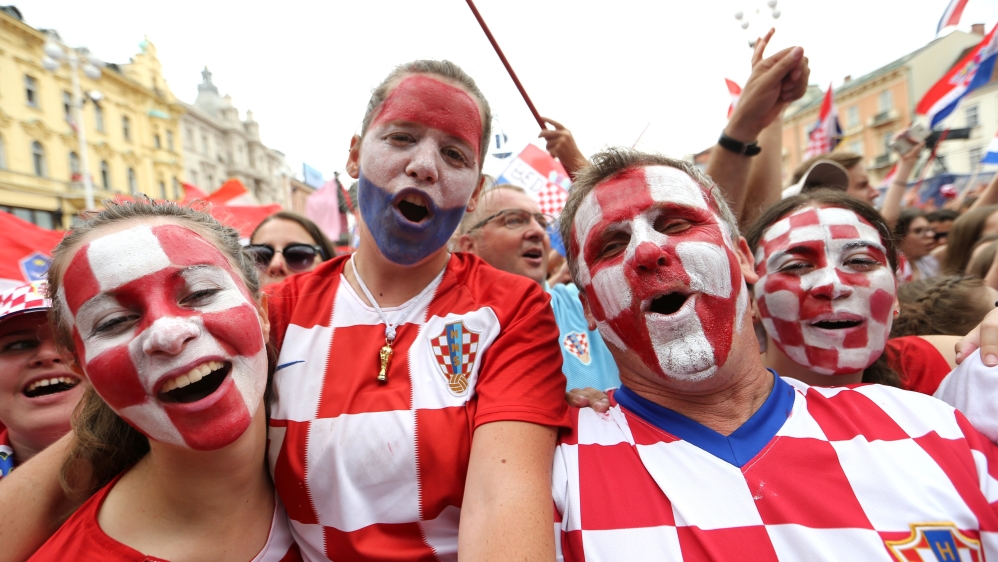 The fans did not stop singing despite the team bus taking almost six hours to reach the city centre [Antonio Bronic/Reuters]