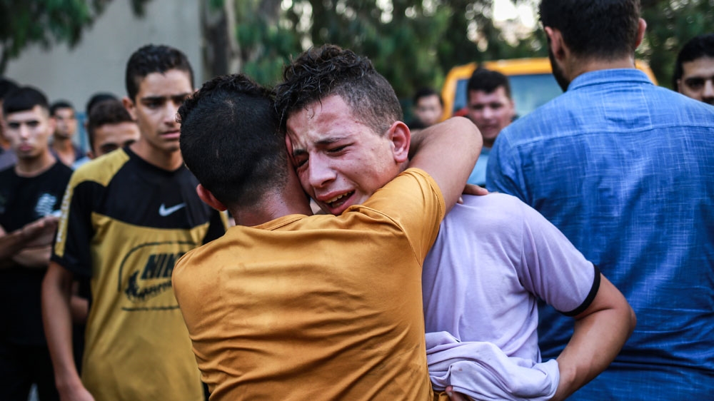 Waleed al-Nimra mourns the death of his 15-year-old brother Amir al-Nimra [Hosam Salem/Al Jazeera]