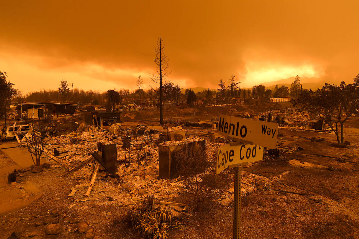 Homes leveled by the Carr Fire line the Lake Keswick Estates area of Redding, Calif., on Friday, July 27, 2018. (AP Photo/Noah Berger)