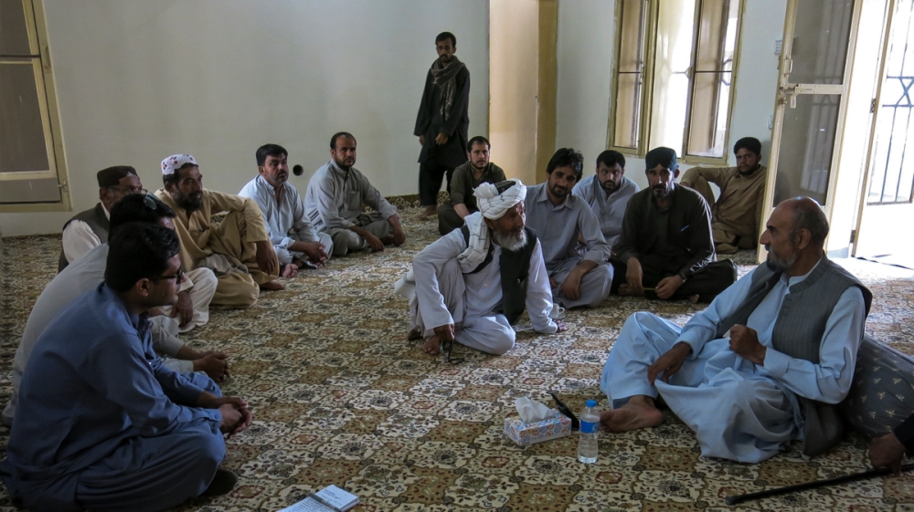 Aslam Raisani, right, a tribal chieftain and political leader, speaks to supporters at a meeting in Mastung [Asad Hashim/Al Jazeera]