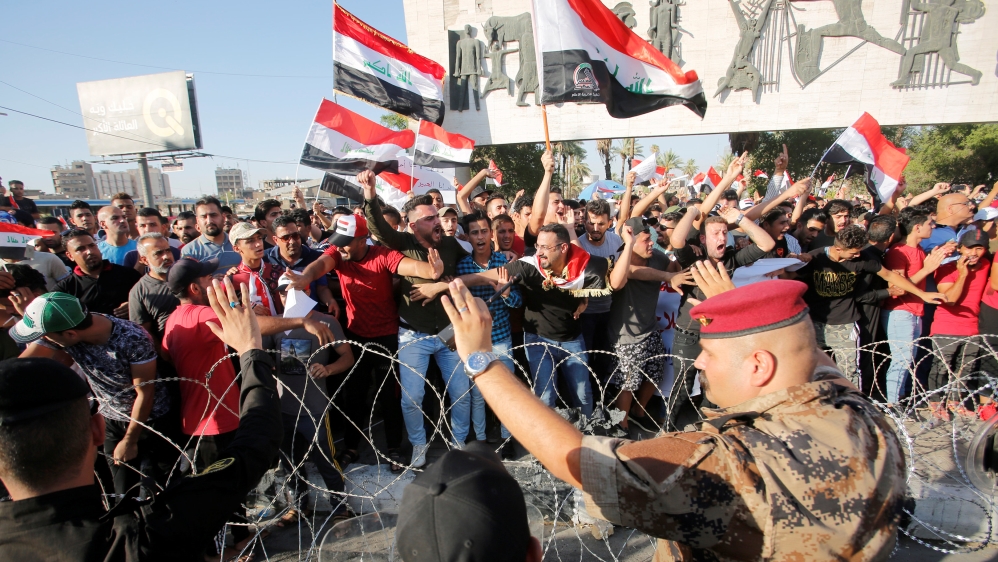 Protesters are being dispersed by riot police during a protest in Baghdad
