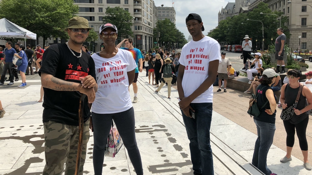 Damshia King brought her two sons to Sunday's rally in Freedom Plaza [Laurin-Whitney Gottbrath/Al Jazeera]