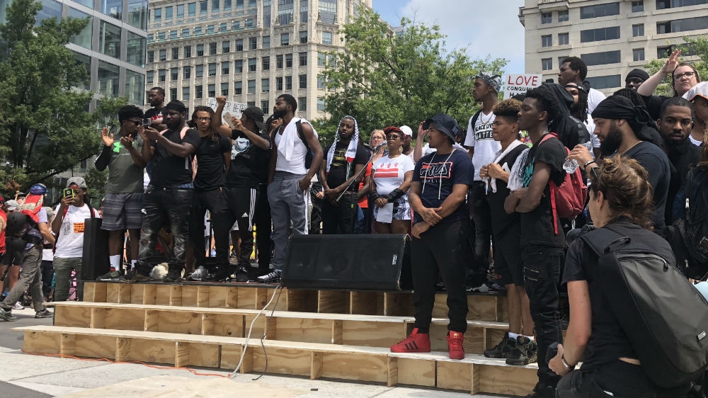 Survivors of last year's deadly attack in Charlottesville led a moment of silence in Freedom Plaza [Laurin-Whitney Gottbrath/Al Jazeera]