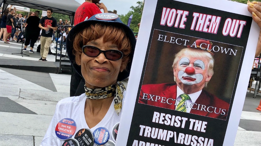 More than a 1,000 people rallied in Freedom Plaza under the banner 'Still here, still strong' [Jet Belgraver/Al Jazeera]