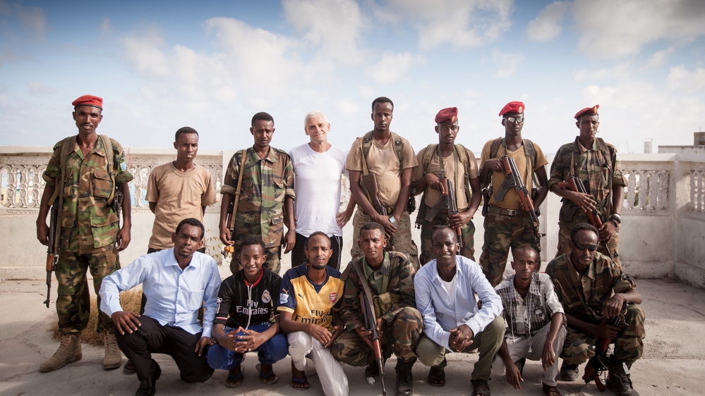 Lost Warrior Filmmakers Nasib Farah, bottom - third from right, and Soren Steen Jespersen, top - fourth from left, with the film's cast and crew and Somali army escorts in Mogadishu [DR Sales]