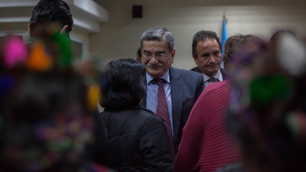 Former Intelligence chief Jose Mauricio Rodriguez greets supporters after being acquitted of committing genocide [Jeff Abbott/Al Jazeera]
