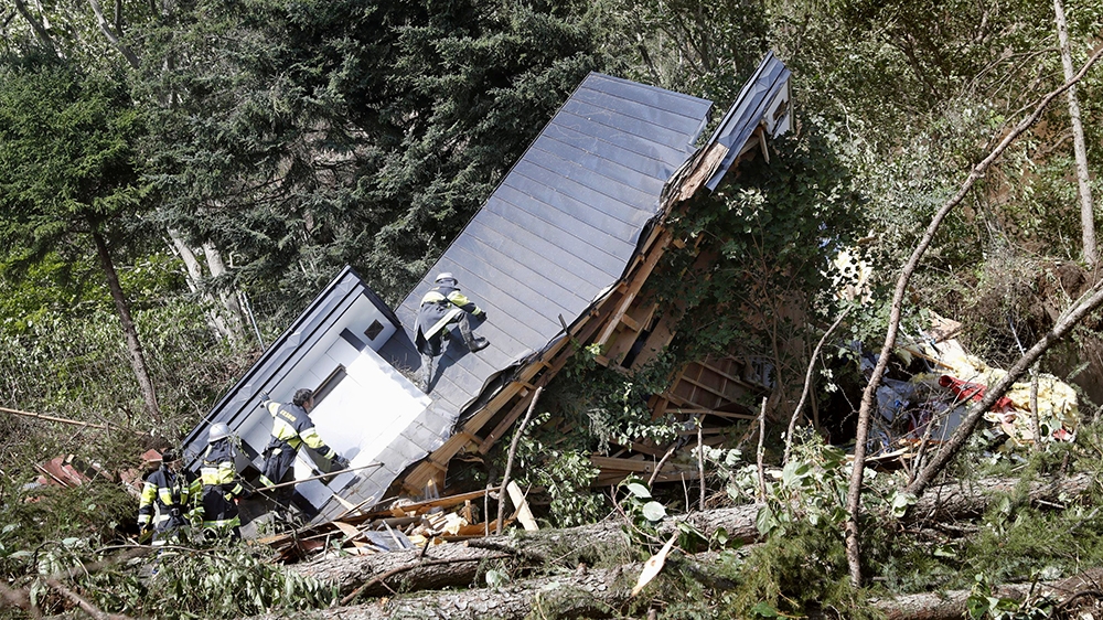 Rescue workers search for survivors after a landslide on Hokkaido [Kyodo/via Reuters]