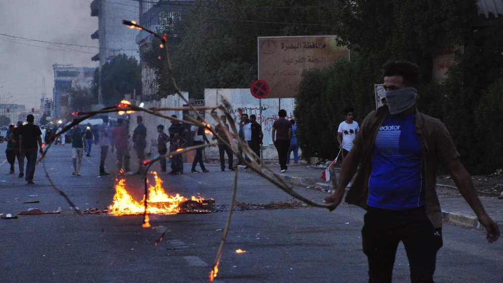 People gather during a protest near the main provincial government building because of the water pollution and poor services in Basra [File: Essam al-Sudani/Reuters]