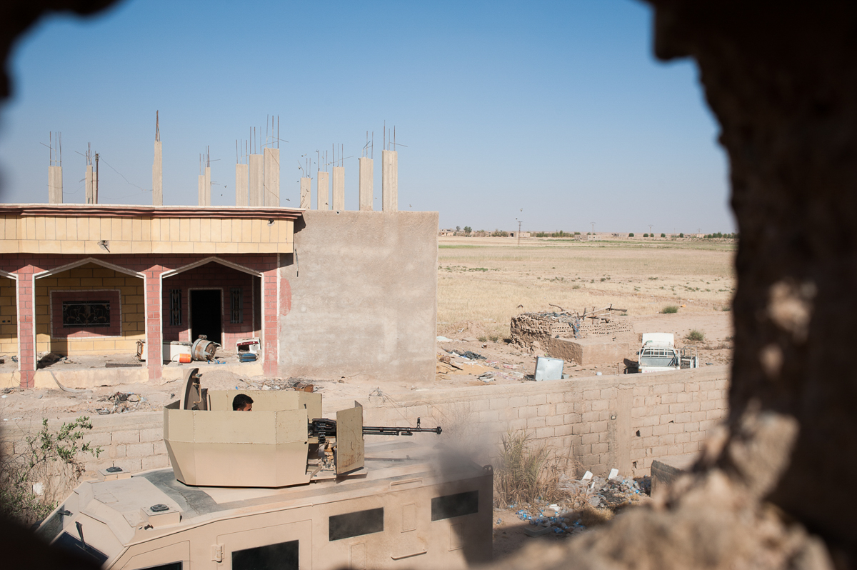 SDF soldier on the DShK on the frontline in the village of Bahara. According to some, al-Baghdadi could be there, but the leader of the Islamic State could have fled before the siege of Hajin and foun