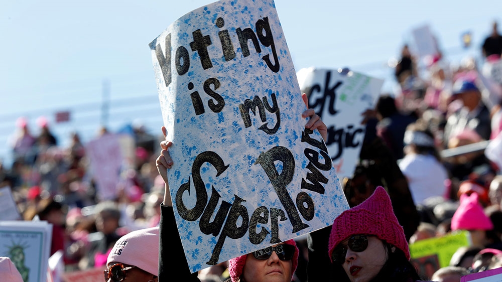 A woman holds up a sign during the Women's March rally in Las Vegas, Nevada [Steve Marcus/Reuters]