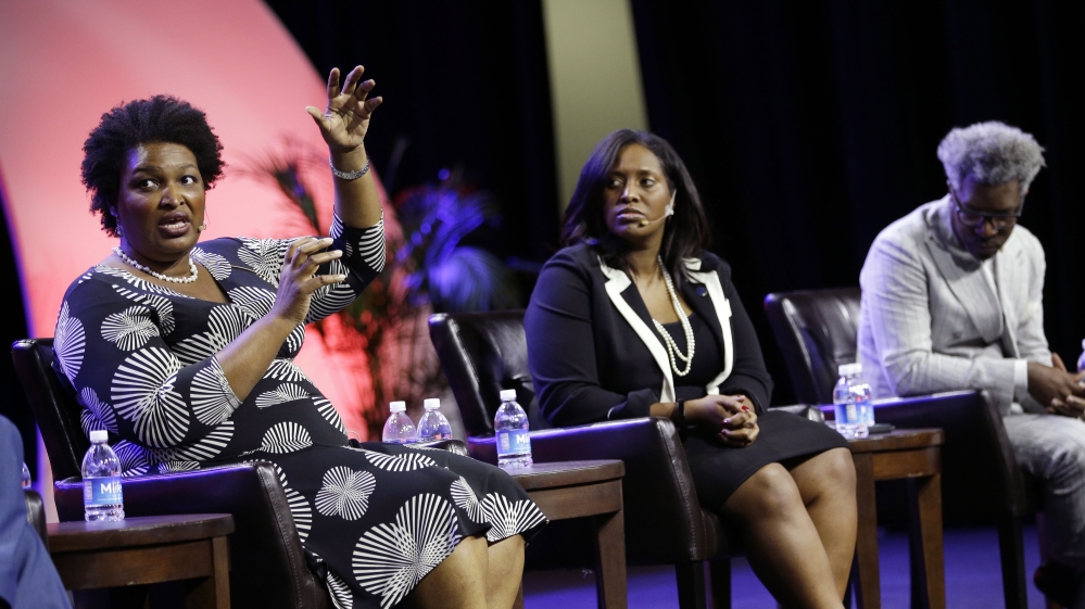 Stacey Abrams is running neck and neck with her Republican rival [John Locher/AP Photo]