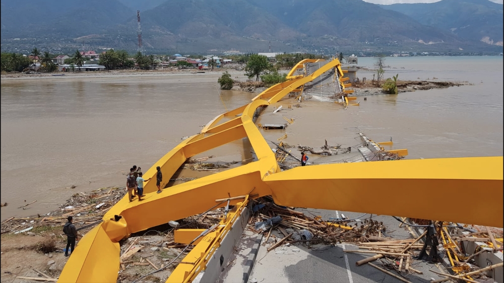 The wreckage of the Ponulele Bridge in Palu. [Ted Regencia/Al Jazeera]