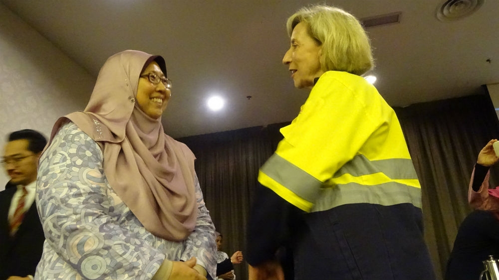 Lynas CEO Amanda Lacaze talks to Kuantan MP Fuziah Salleh who has campaigned against the rare earths plant since the beginning [Florence Looi/Al Jazeera]