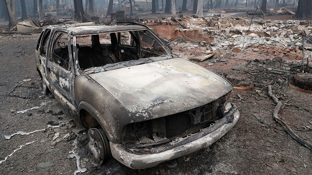 A car destroyed by the Camp Fire is seen in Paradise, California [Terray Sylvester/Reuters]
