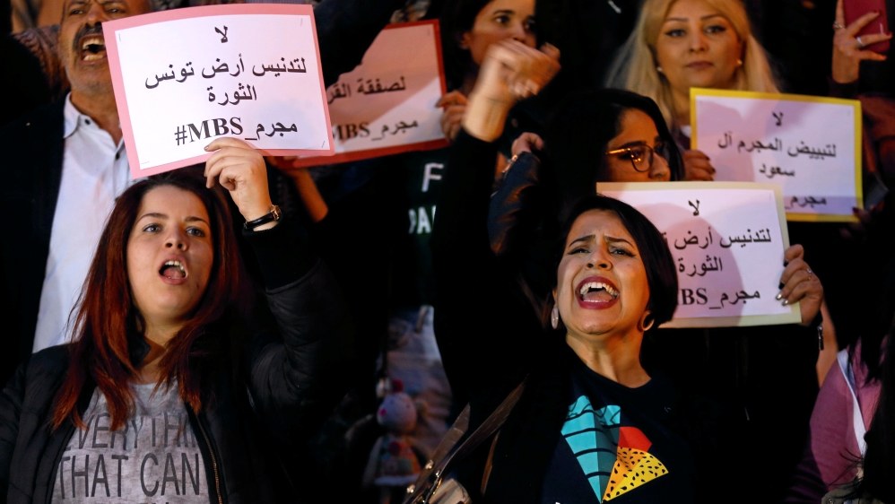 Protesters shout slogans and hold signs opposing visit of Saudi Arabia''s MBS in Tunis