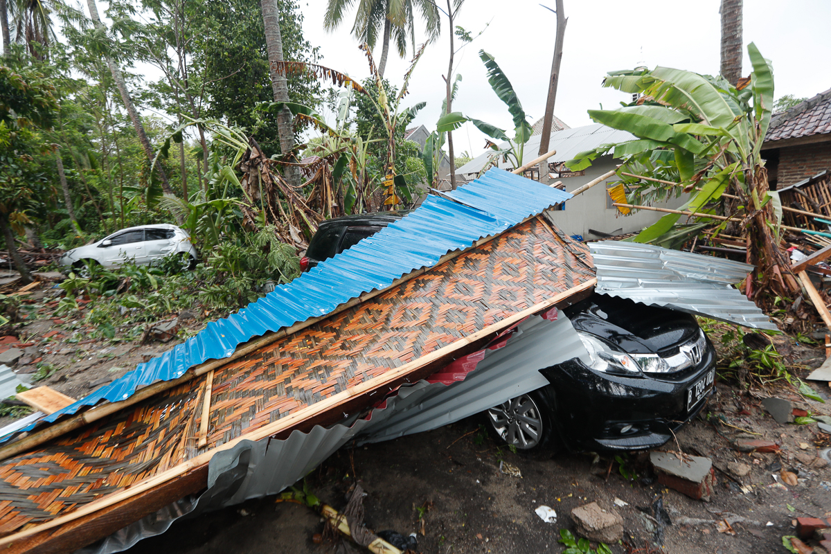 Cars sits among debris after a tsunami hit Sunda Strait in Anyer, Banten, Indonesia, 23 December 2018. According to the Indonesian National Board for Disaster Management (BNPB), at least 43 people are