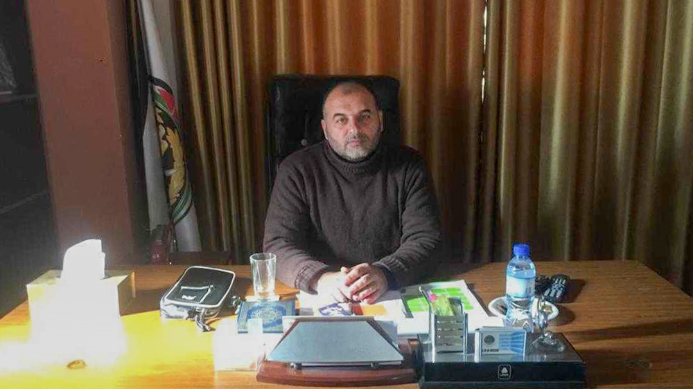 Gaza police spokesperson Ayman al-Batniji says the police, as a civil service, is not affiliated with Palestinian factions [Maram Humaid/Al Jazeera]