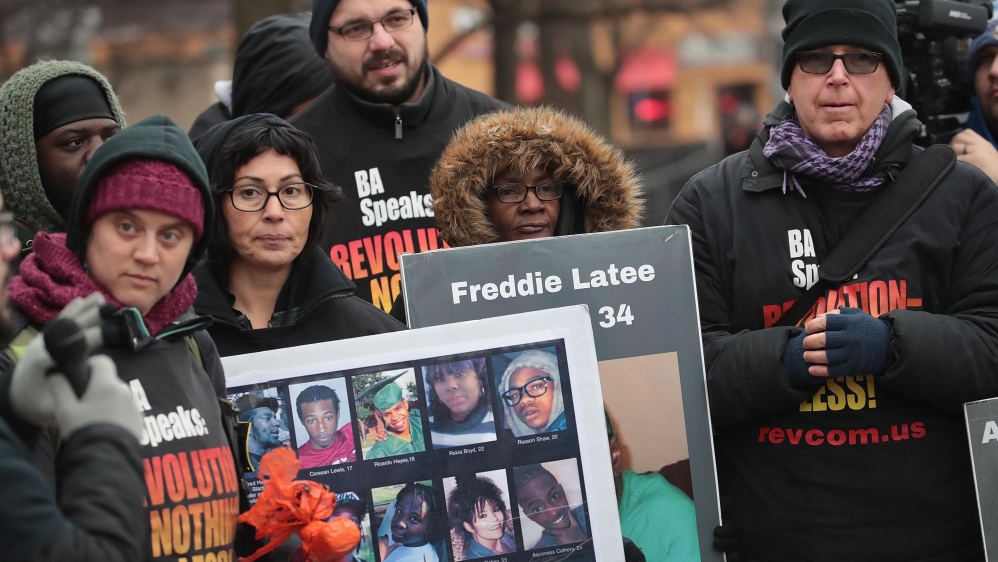 Activists protest outside the Cook County court after the sentencing of former Chicago police officer Jason Van Dyke [Scott Olson/Getty Images/AFP]