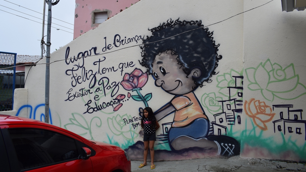 Penha's hilltop nursery sits inside walls riddled by bullet holes [David Child/Al Jazeera]