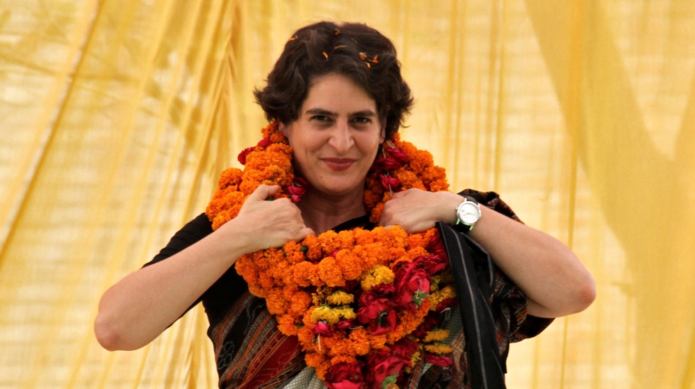 FILE PHOTO: Priyanka Gandhi Vadra adjusts her flower garlands during an election meeting at Rae Bareli