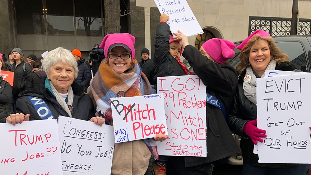 Sherry Cain brought her daughters, granddaughter and great-grandson to the march [Laurin-Whitney Gottbrath/Al Jazeera] 