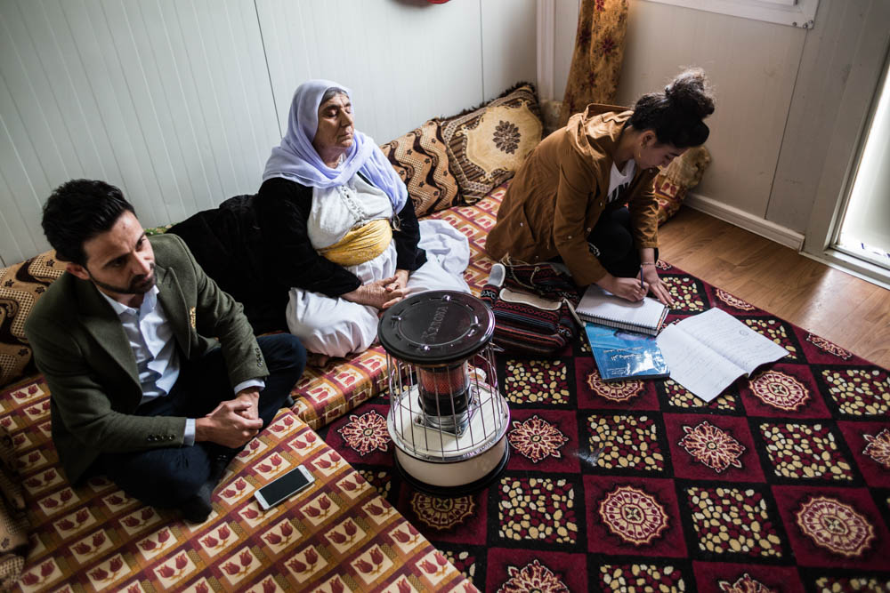 Husna, her grandmother and uncle within the container where they live in the Refugees’ camp. Her grandmother doesn’t want to live anywhere but in her village; youngers as Husna thinks differently and