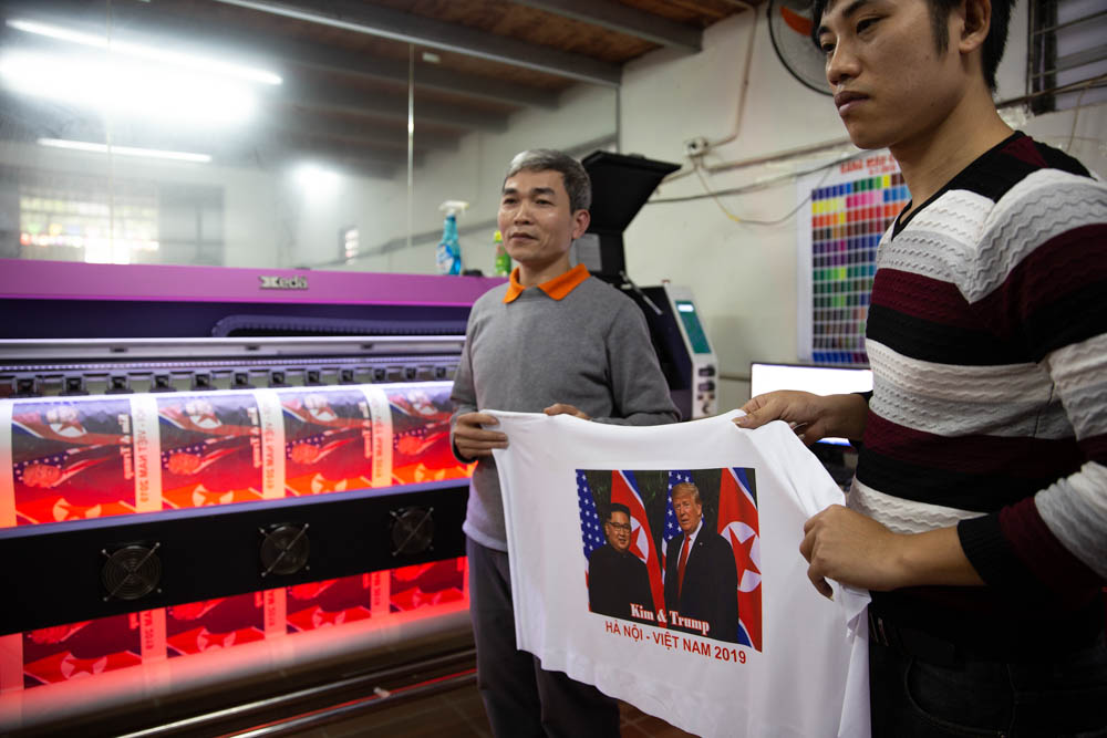 Hieu Dinh Van (left) is one of the tshirt manufacturers in Hanoi. His tshirts are now being copied and sold elsewhere in the city. He also said that due to the unexpectedly high demand, his factory wa