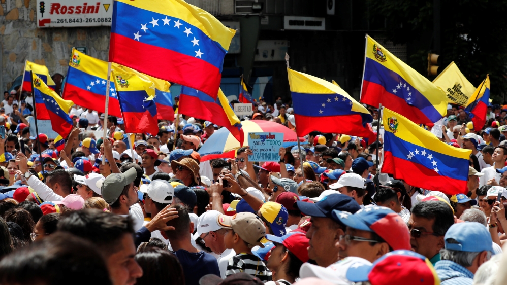 Supporters of the Venezuelan opposition leader take part in a rally in Caracas [Carlos Jasso/Reuters]